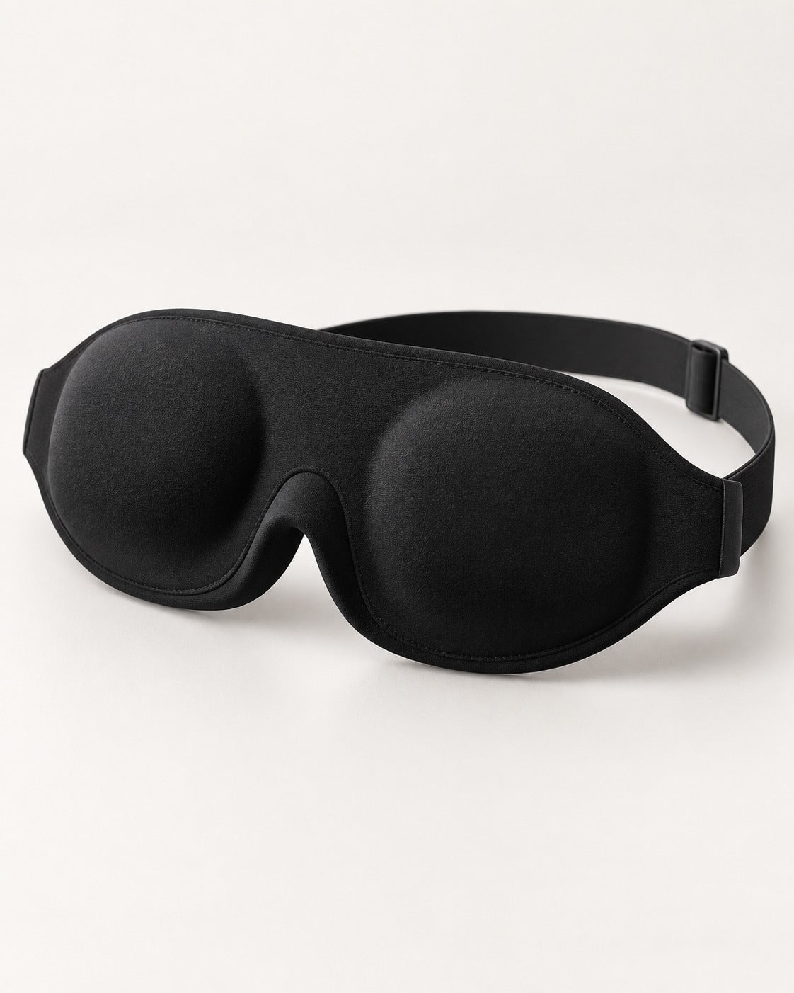 Pillow-Side contoured sleep mask with recessed eye cups and adjustable strap